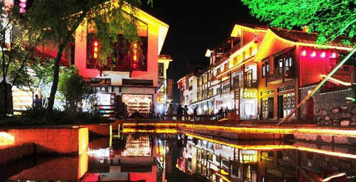 Tourists Enjoy Bonfire Party at Zhangjiajie Xibu Street