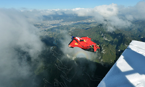 Chinese Wingsuit Flying Though Clouds after Snow